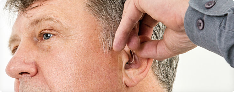 How to Put on and Remove Hearing Aids - TruHearing