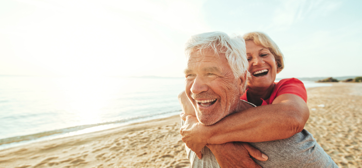 couple on beach having fun