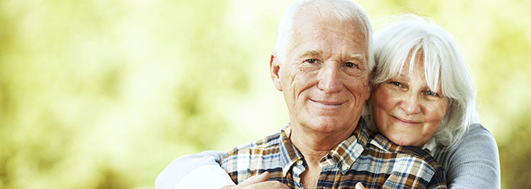 older couple hugging and smiling