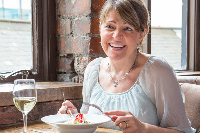 woman eating in a restaurant
